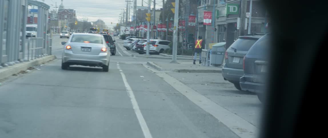 Vehicles travel on the city street