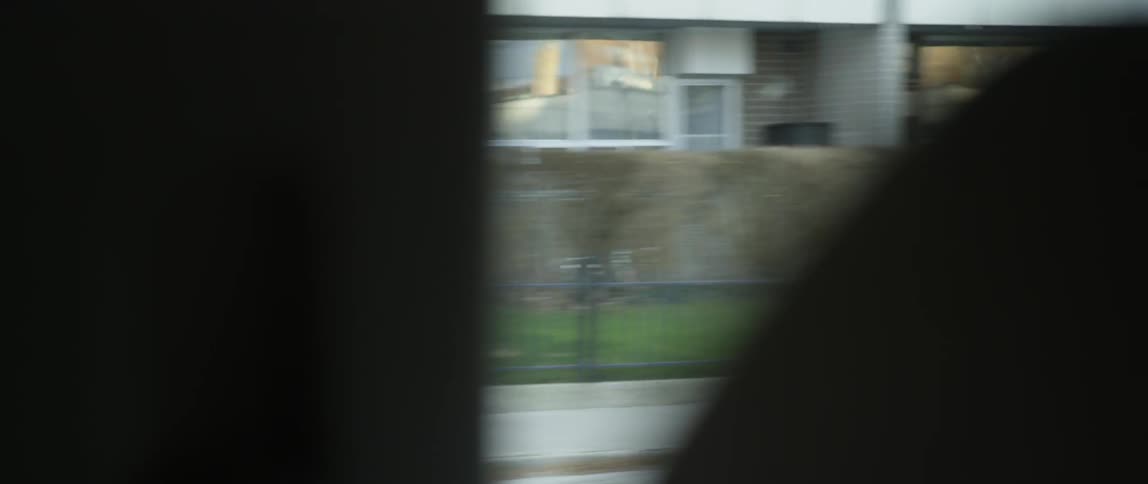 A vehicle travels on a city street