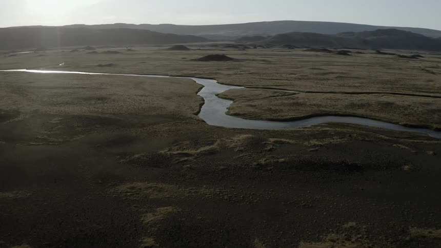 A river is wending through a natural setting in daylight