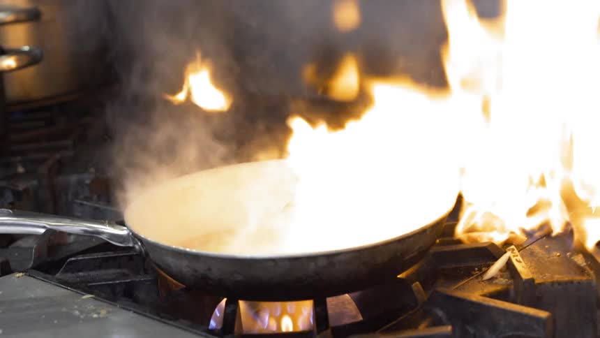 Oil ignites a skillet on the stove