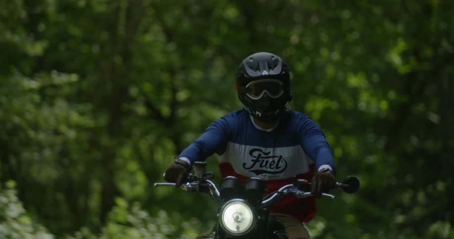 Man is riding motorcycle on sunny day