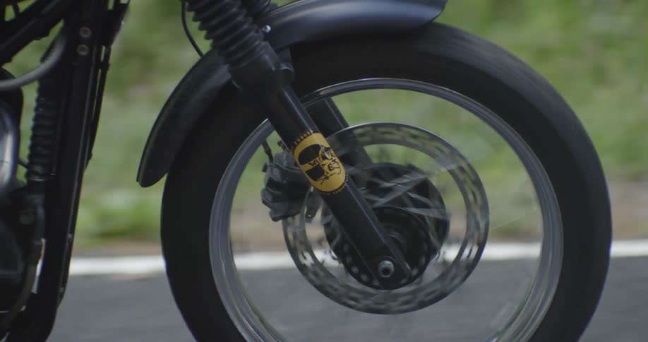 A motorcycle rides on the road