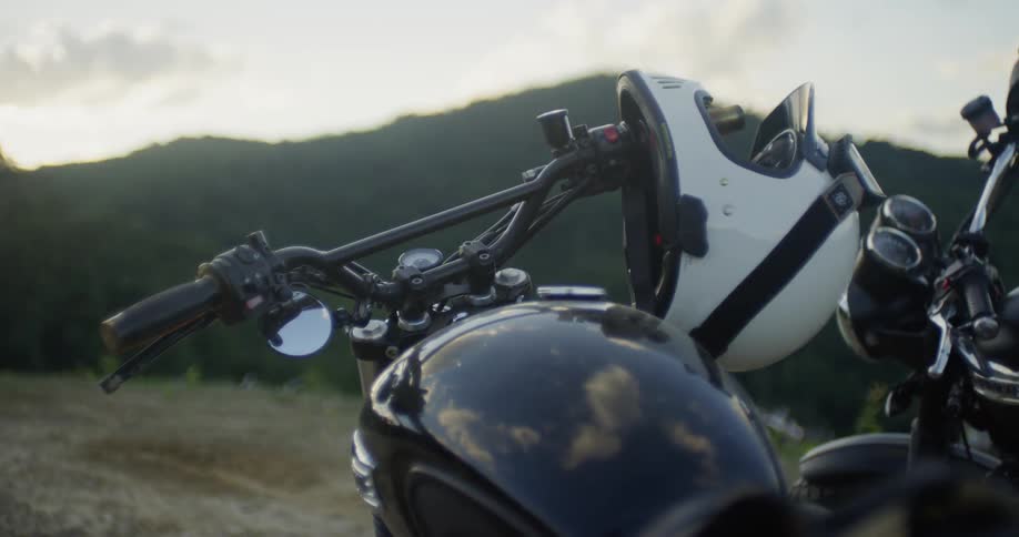 A helmet rest on the handlebar of a bike