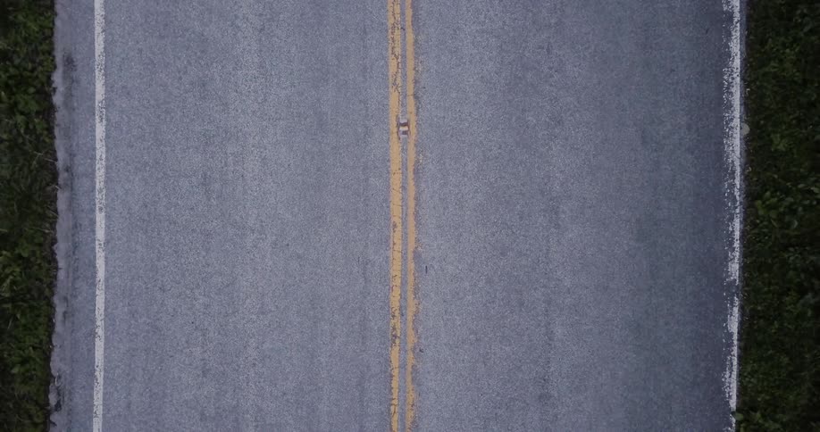 Motorcyclists pass on the road
