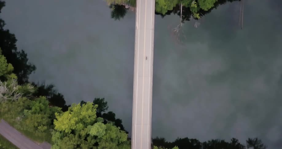 A vehicle drives over a bridge