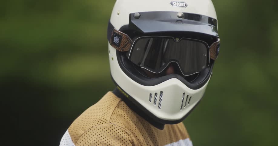 Person wearing a helmet looks around