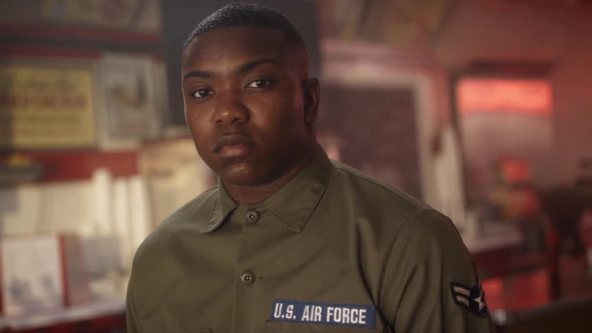 A service member sits in a diner