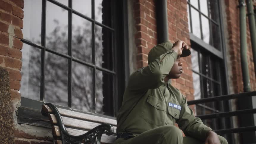 A soldier sits on the bench