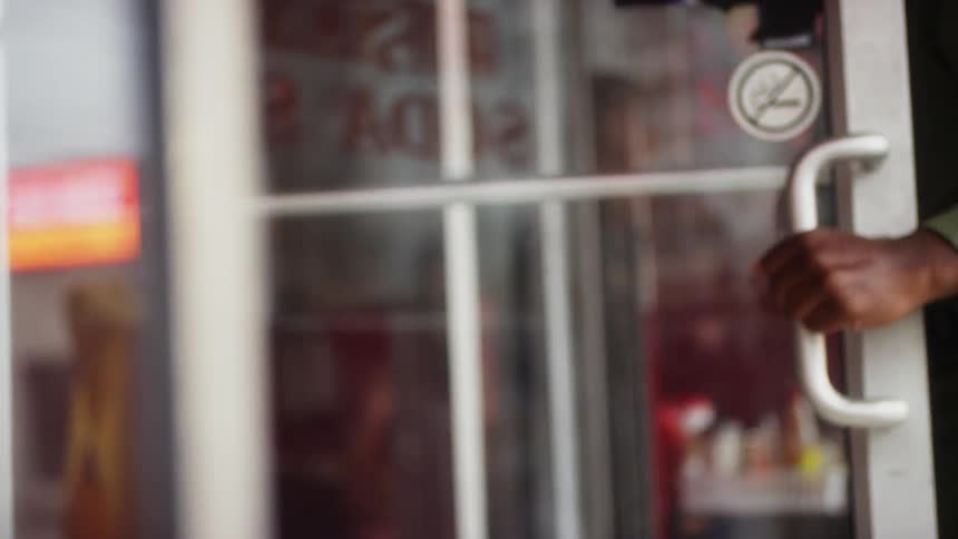 A service member enters a soda shop