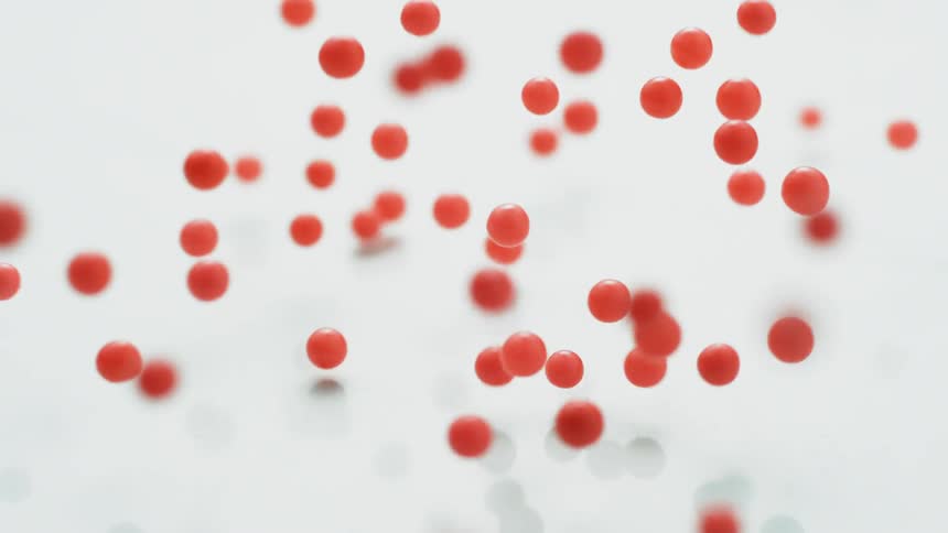 Orange balls bounce on a white surface