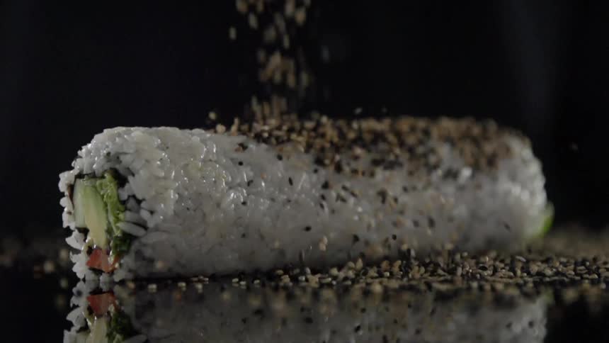 Seeds are sprinkled over sushi