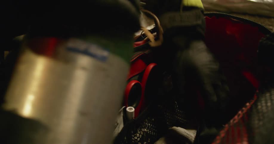 An emergency responder looks through a bag of supplies