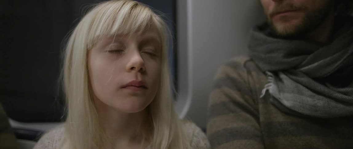A girl rides on the subway