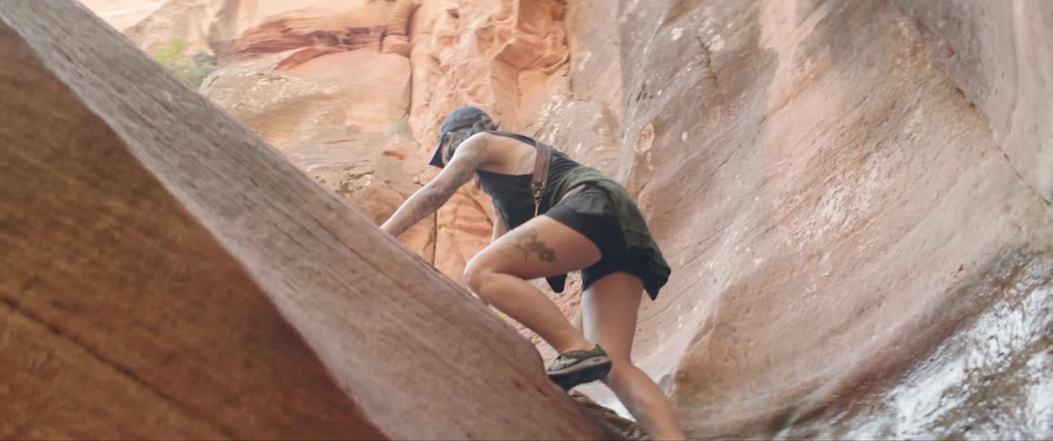 Woman Taking Photographs And Exploring Canyons