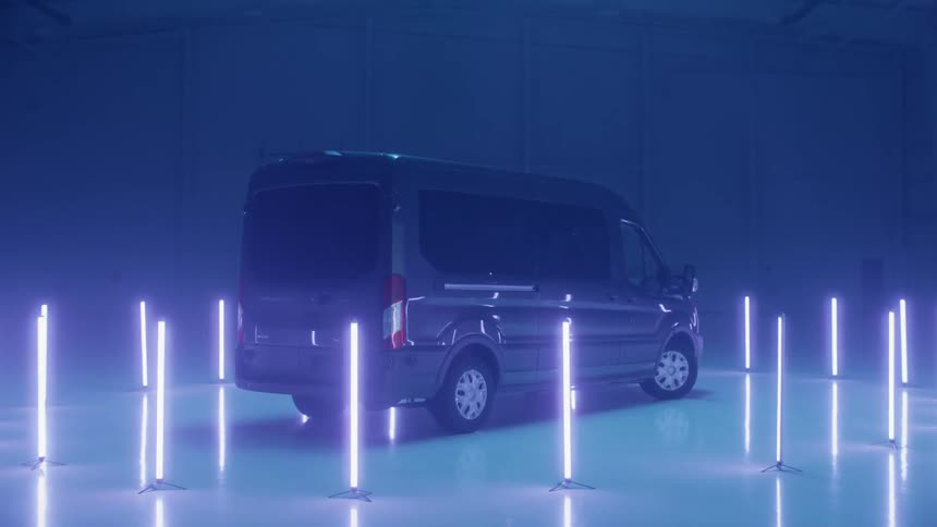 A van is illuminated by purple lights