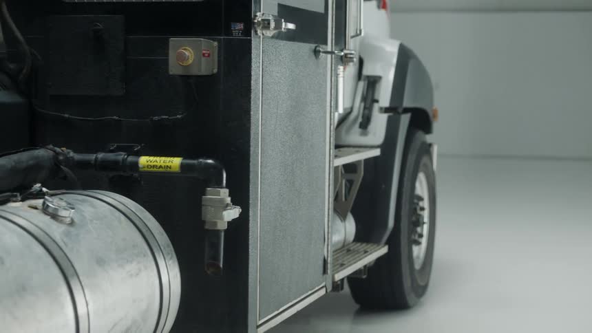 White semi truck parked in a large garage
