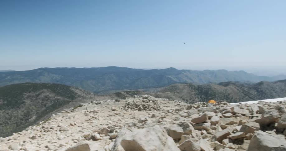 Rocks are scattered atop the mountain