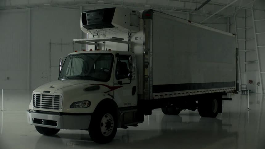 A refrigerator truck in a warehouse