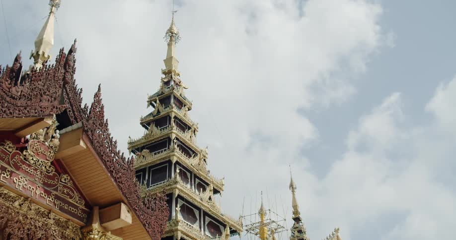 Gold decorated spires and ornate roof lines on temples