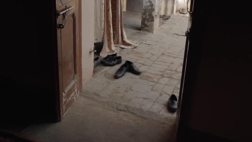 Shoes sit outside the door