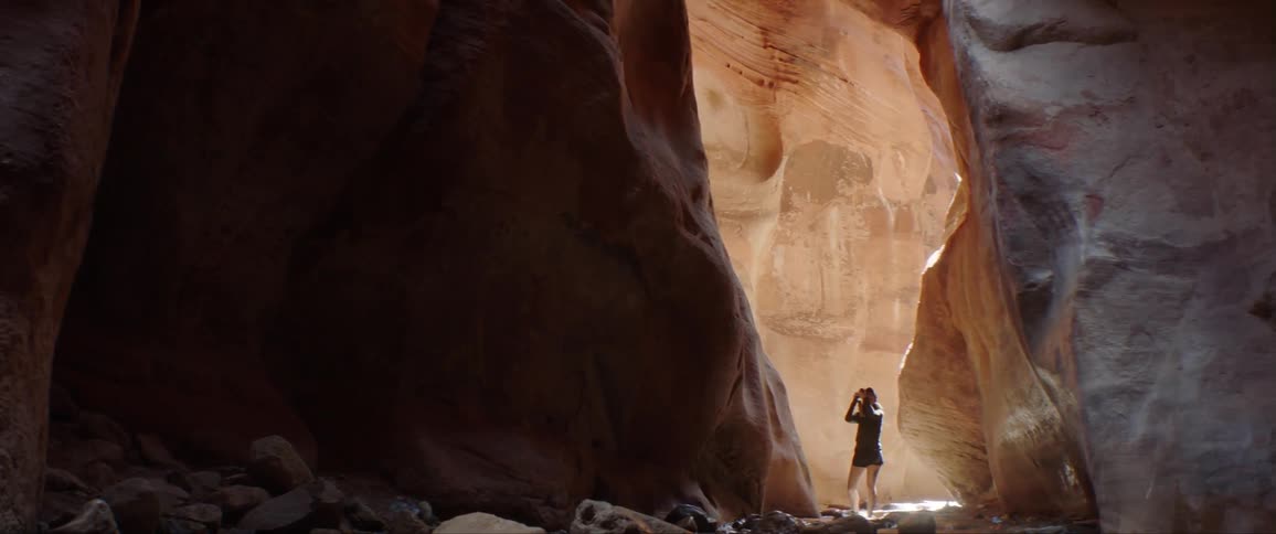 Woman Taking Photographs And Exploring Canyons