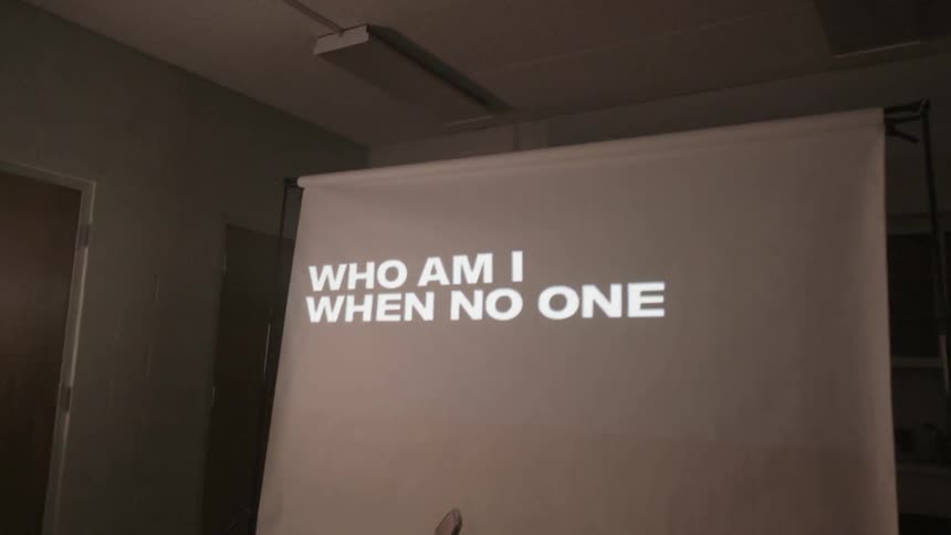 Words are projected onto a screen