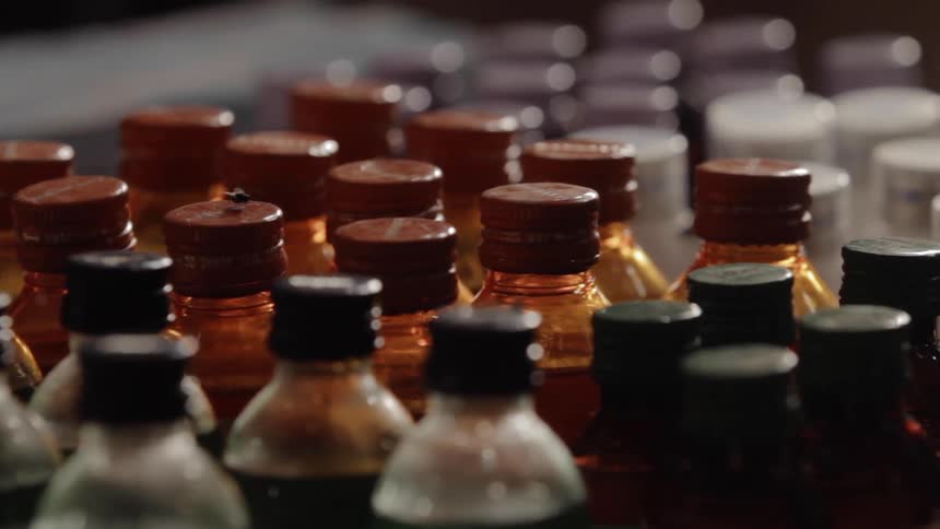 Assorted bottles sit in rows