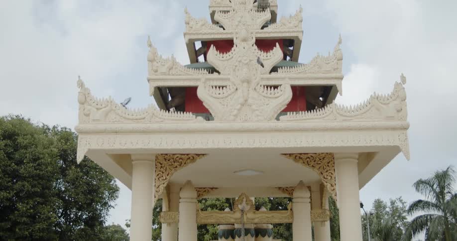 A large ornate tower surrounded by a fence