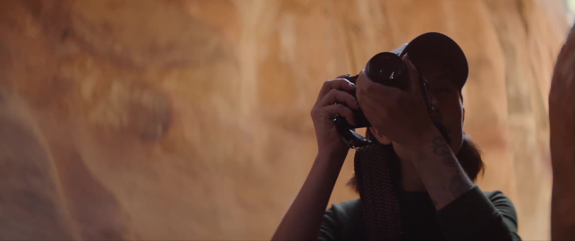 Woman Taking Photographs And Exploring Canyons