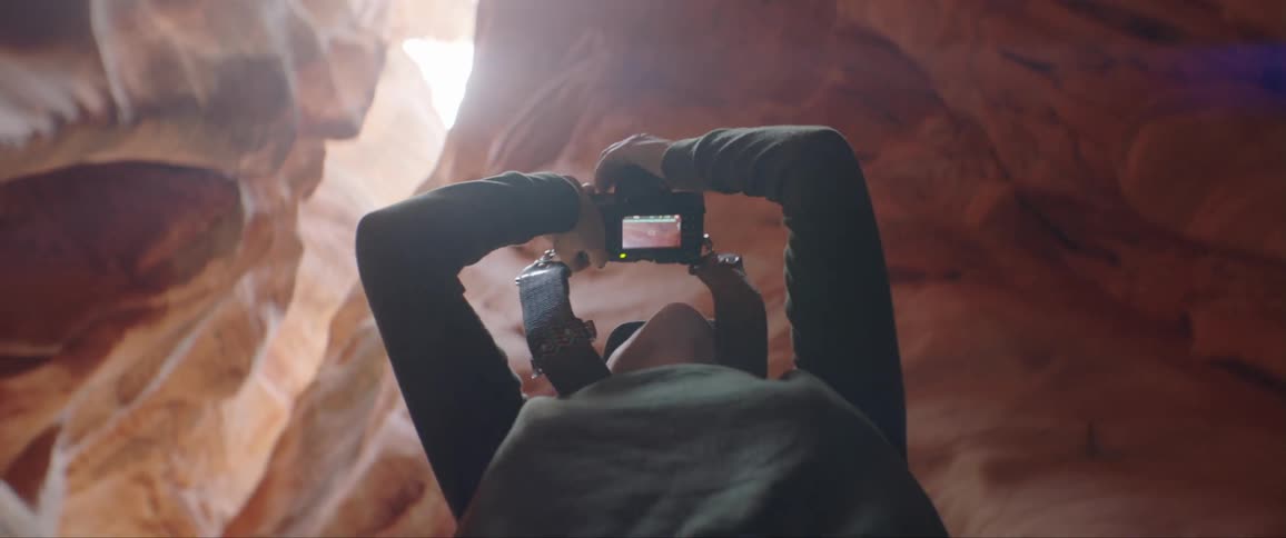 Woman Taking Photographs And Exploring Canyons