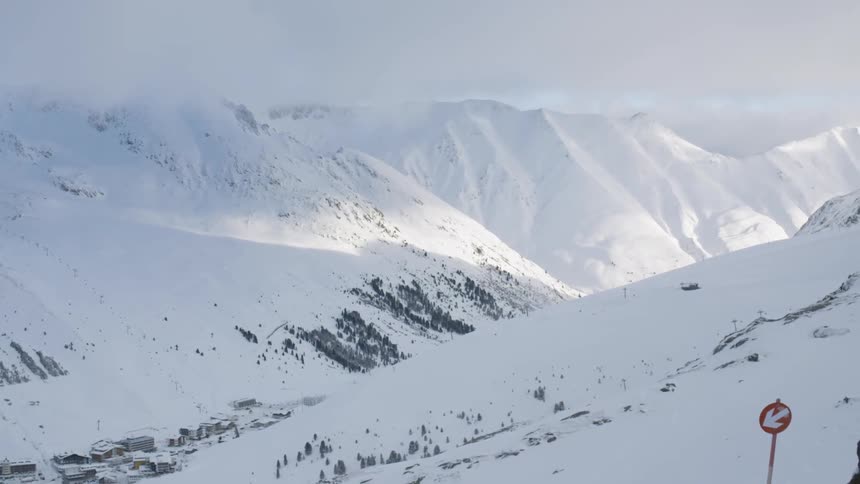 Snow covers the mountain landscape