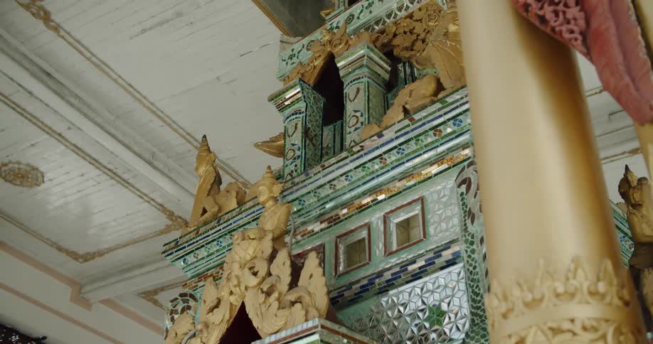 Statues on a glass mosaic tile temple