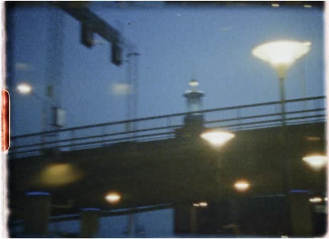 Cars travel in a city at night
