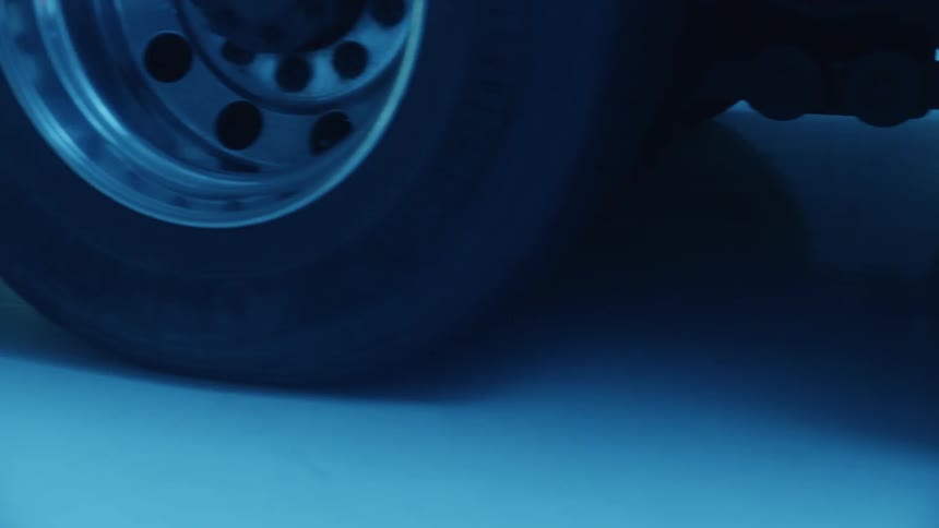 The truck tires are on the garage floor