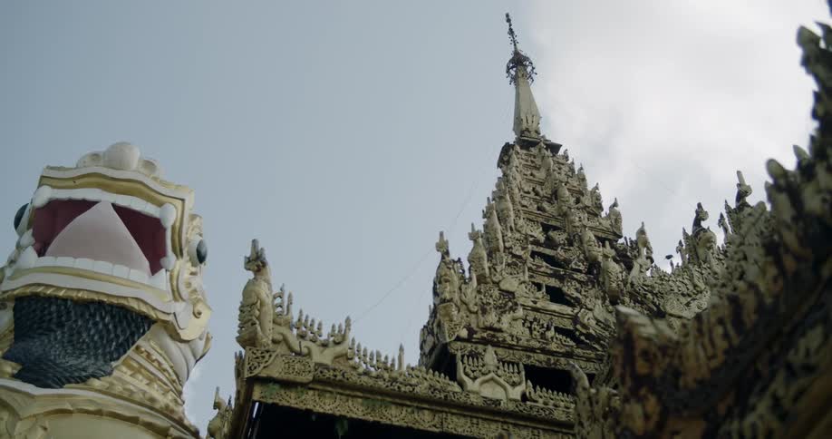 The building has a large gold tower at the top