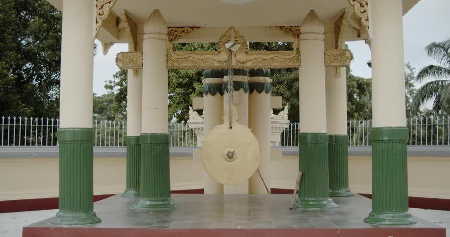 A large ornate gazebo surrounded by a fence