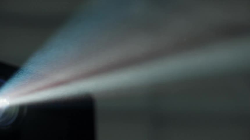 Projector flashes bright light in the dark