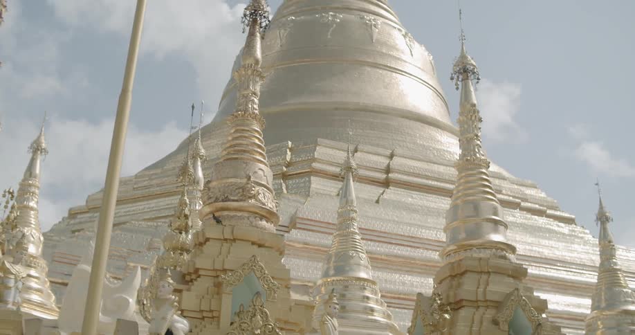 The large building is gold in color
