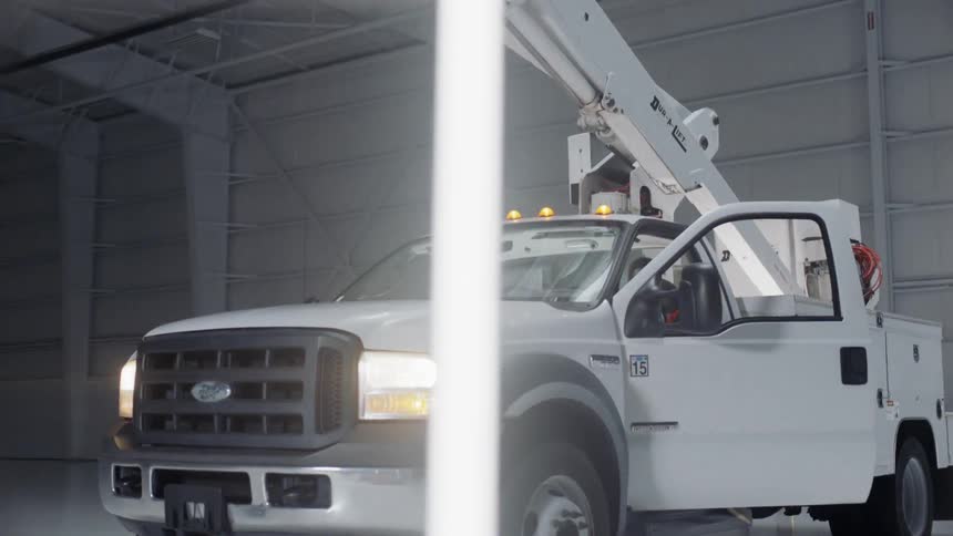 A man exits a utility truck