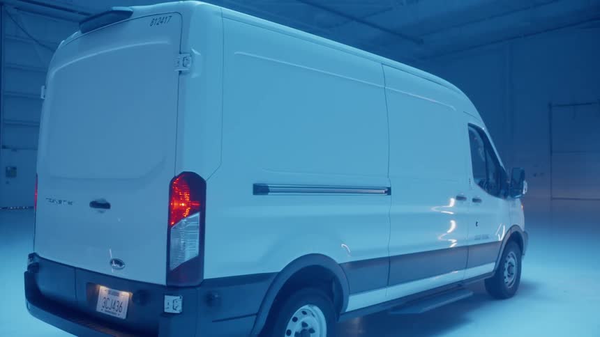 White van is parked in warehouse