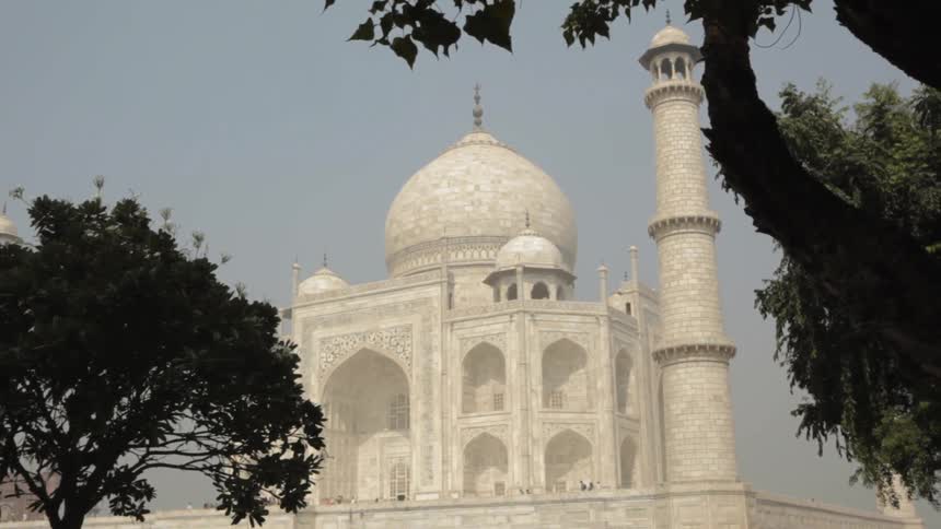 The large building ahead has a dome at the top