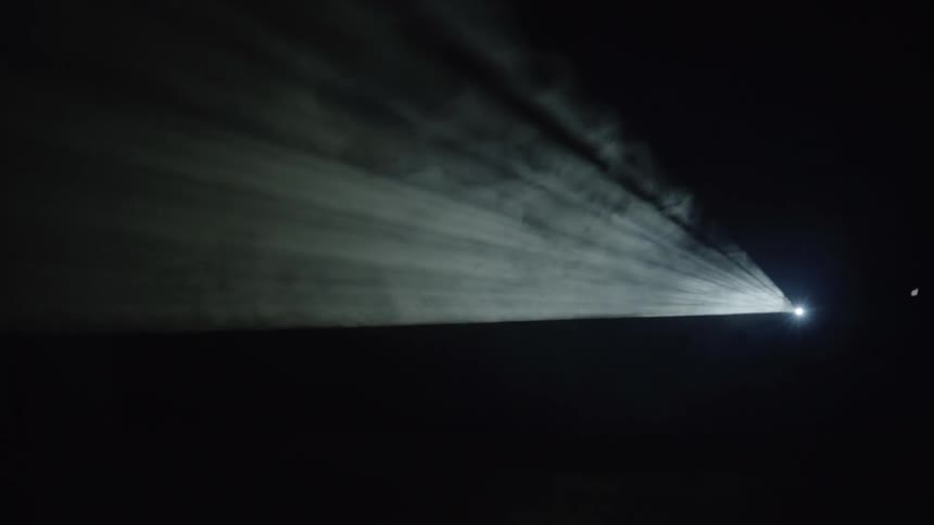 A light turns on and illuminates a dark space