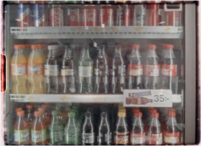 Beverages are displayed for sale in a store