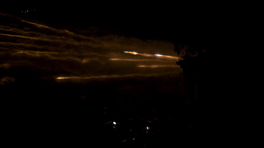 Fireworks are launched into the night sky