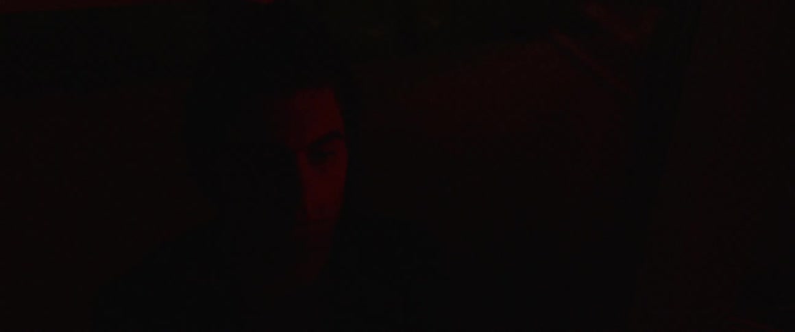 Man closes his eyes as darkness ensues