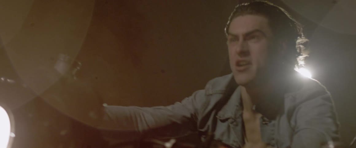 A man is happy as he rides on the motorcycle
