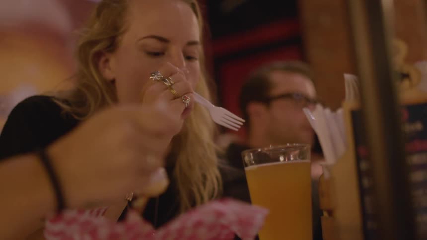 A group of people eat at a restaurant