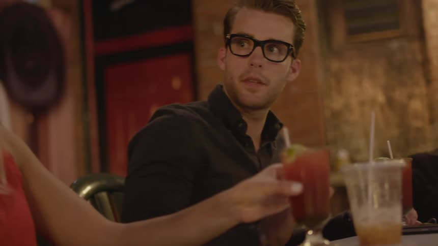 A group of people drink beverages in a restaurant