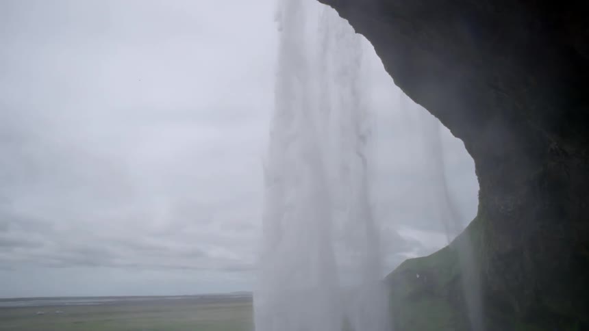 A waterfall on an overcast day in slow motion