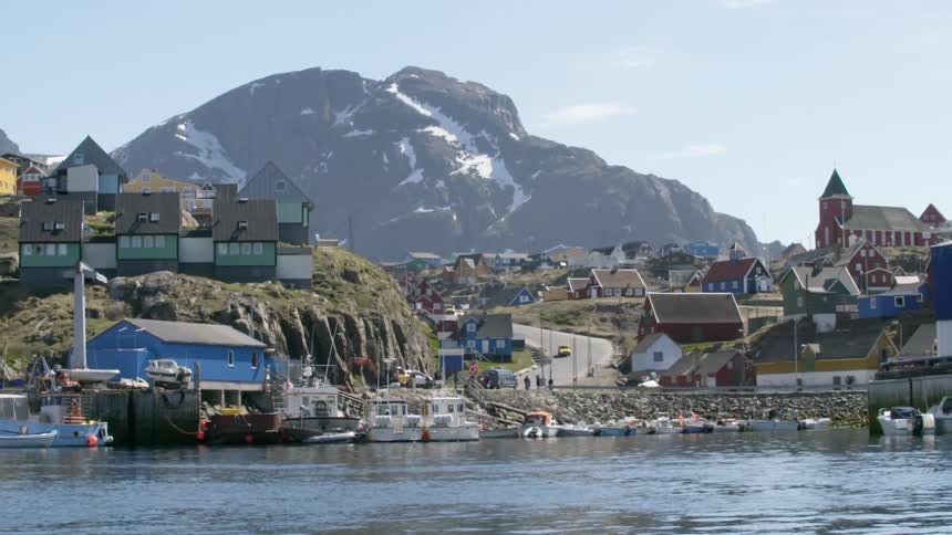 Buildings line a body of water